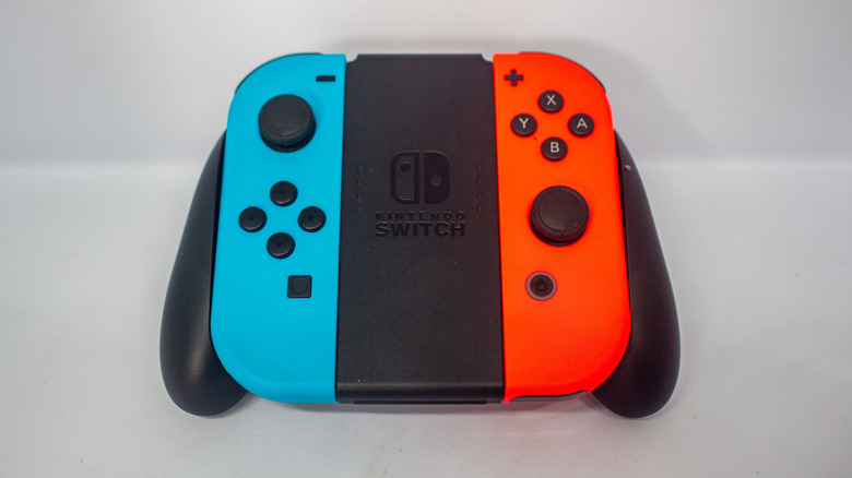 A pair of Nintendo Switch Joy-Cons in a grip.