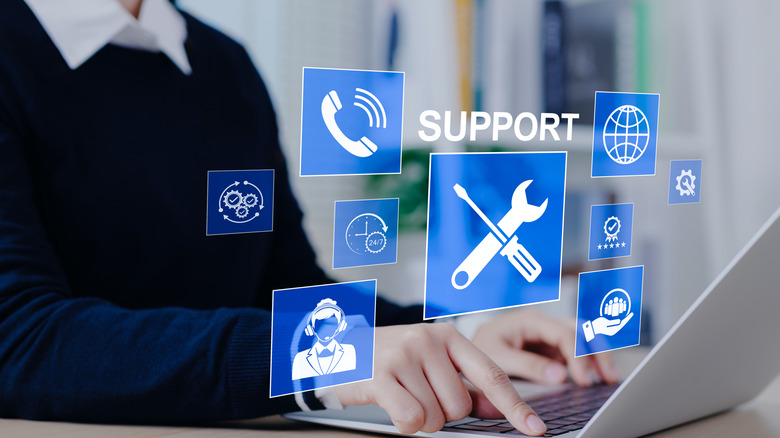 Support and contacts symbols over a computer