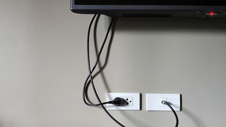 messy cables dangling from tv