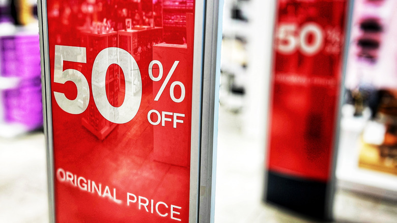 Sign showcasing 50% discounts at retailer