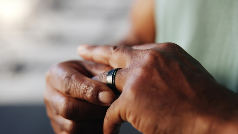 Smart ring, fitness and hands of man in gym for tracking exercise, training and workout progress.