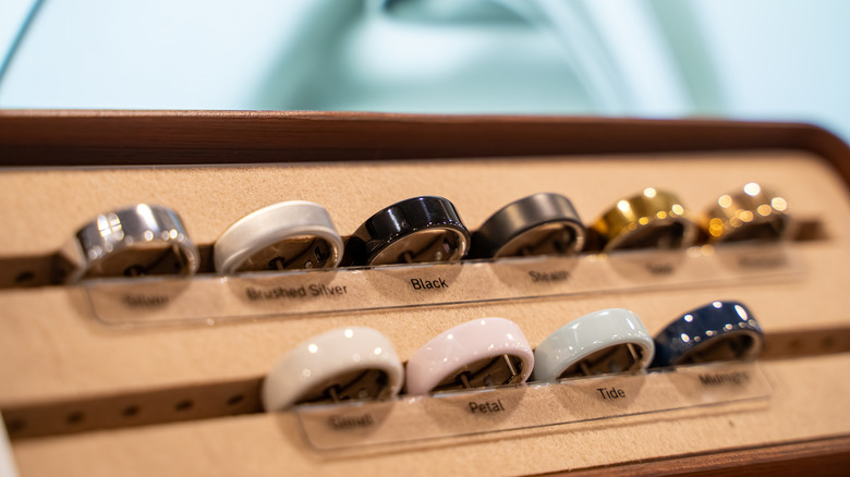 View of Oura smart rings displayed on a retail showroom stand.