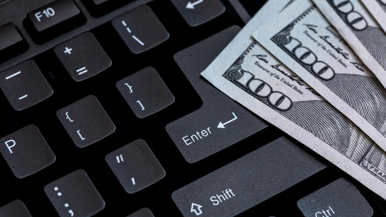 Hundred dollar bills on keyboard