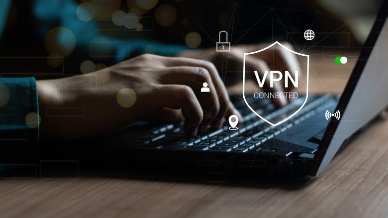 Person typing on a laptop with a VPN connected security graphic overlaid.