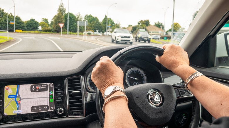Person driving with a map app in New Zealand