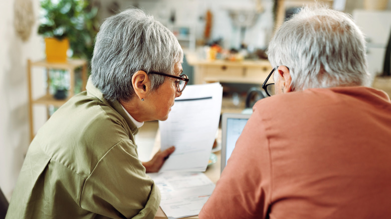 couple looking over expensive bills