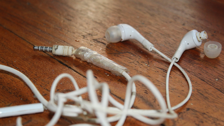 Earbuds with a damaged wire close to the connector