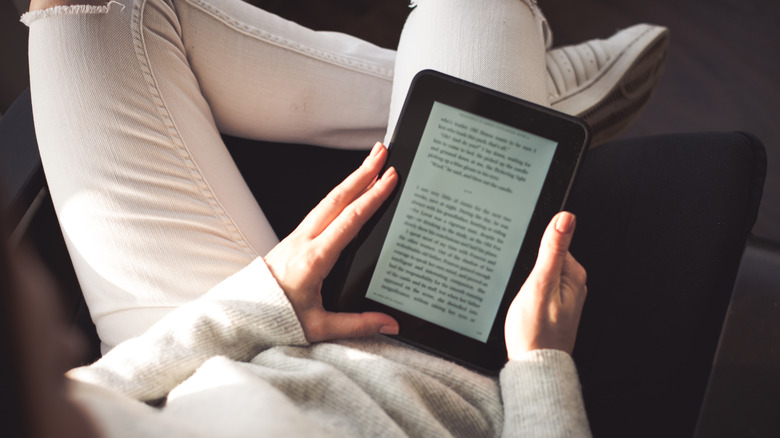A person reading an eBook on an e-reader