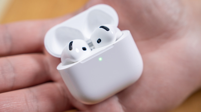 AirPods 4 in a white charging case