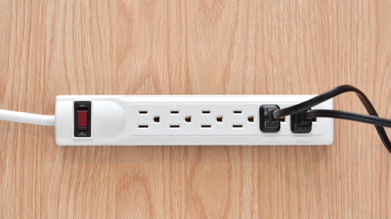 Plugs plugged into a power strip.