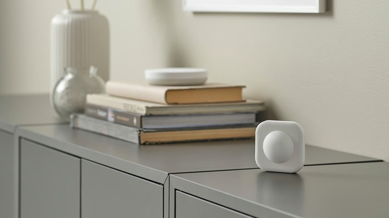 Vallhorn Wireless Motion Sensor on counter with books