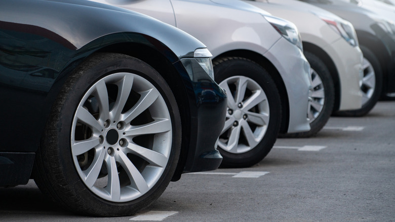 A line of diagonally parked cars.