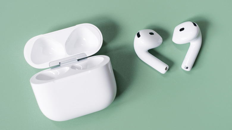 Apple's AirPods on green background