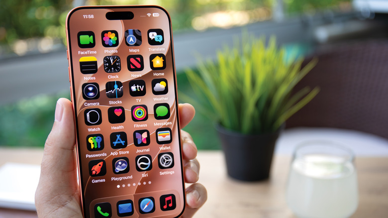 Hand holding Apple's iPhone