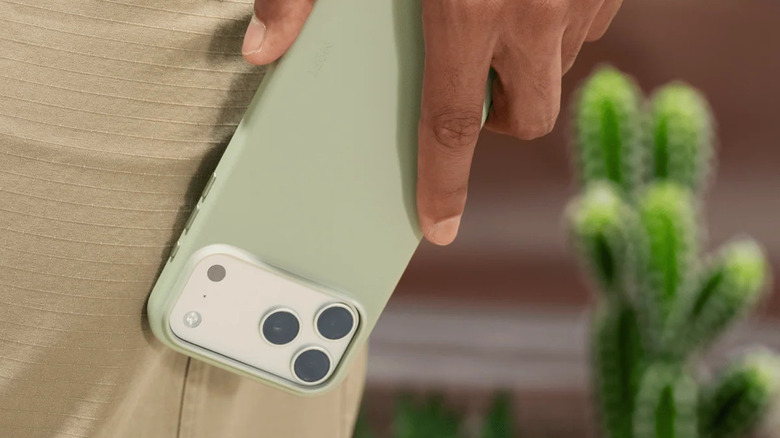 Hand holding an iPhone with MOFT's case