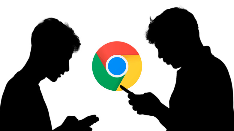 A silhouette of two people with Chrome logo in the background