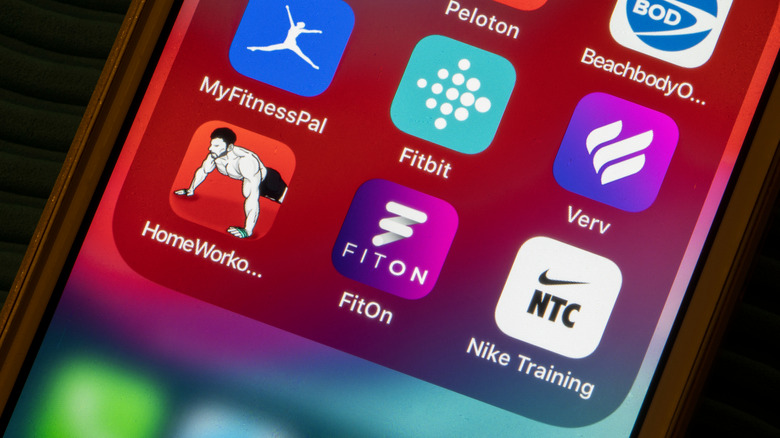 The FitOn app amongst other fitness apps on a smartphone screen