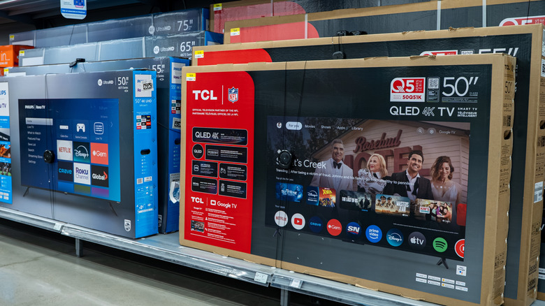 TCL TVs on a shelf in a retail store
