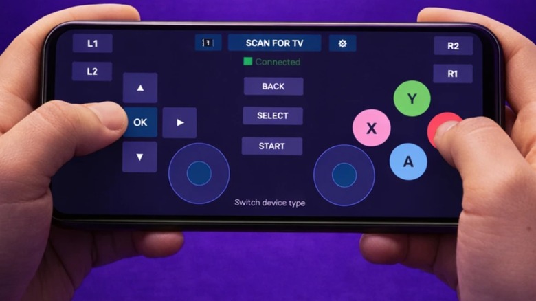 Person holding smartphone running Gamepad for Android TV in front of purple background