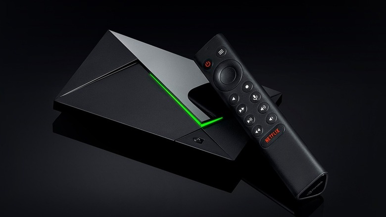 Nvidia Shield TV Pro device and remote in front of a black background