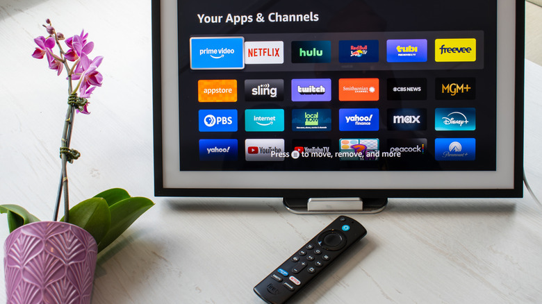 Amazon Fire TV remote and screen showing apps