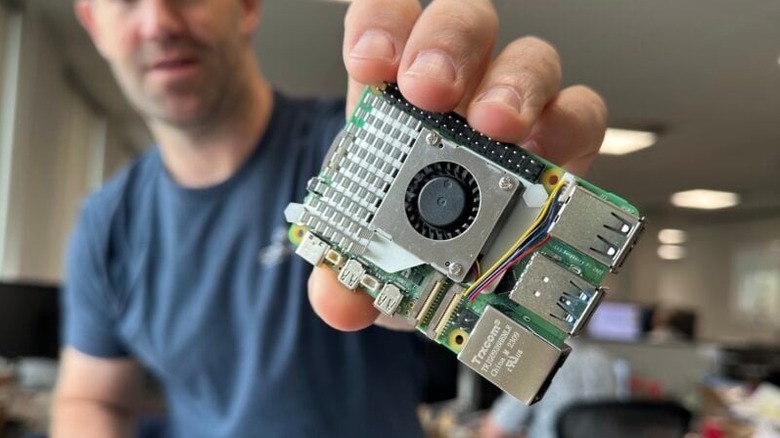 Man holding Raspberry Pi with Active Cooler installed