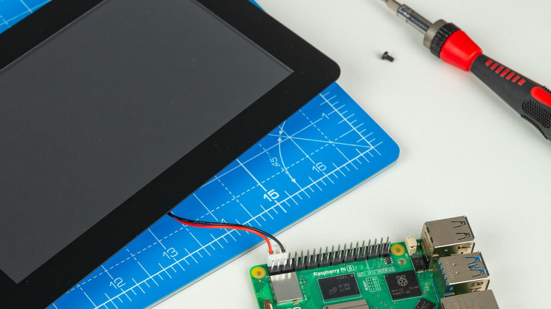 Raspberry Pi Touch Display 2 on table with Raspberry Pi board