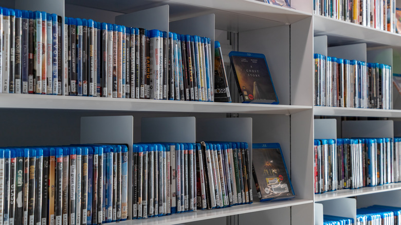 A collection of Blu-ray movies occupying a series of shelves