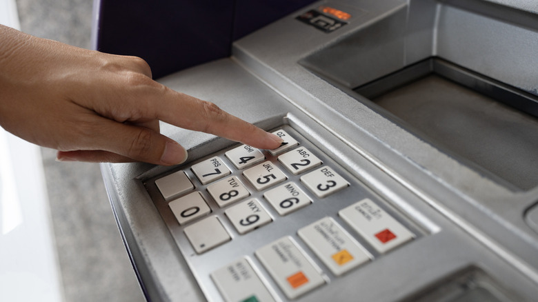 Pressing buttons on an ATM