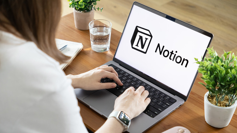 Person using Notion on a MacBook