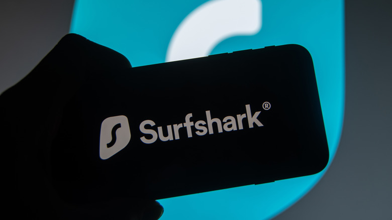 Surfshark logo on a smartphone.