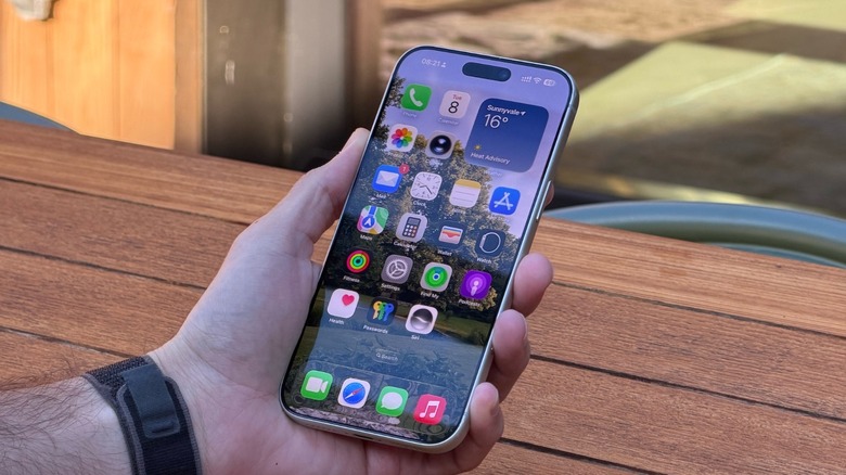 A hand holding an iPhone