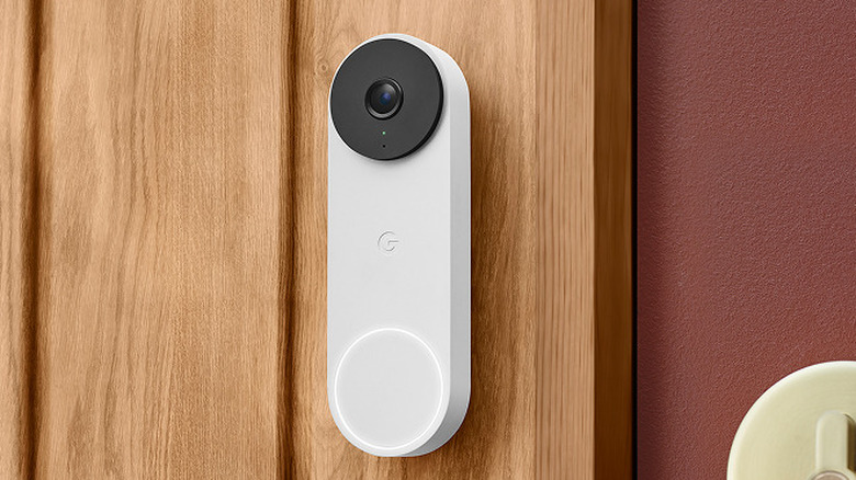 Google Nest Doorbell Wired 3rd Gen mounted on a wooden door.