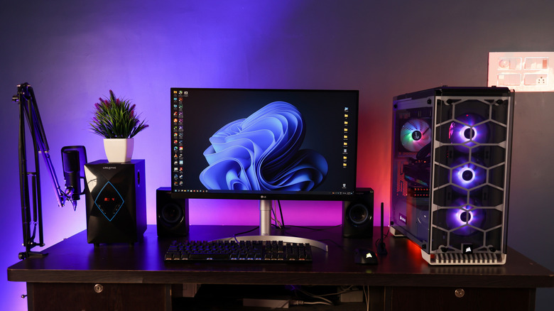 A Windows 11 gaming PC setup with RGB lighting