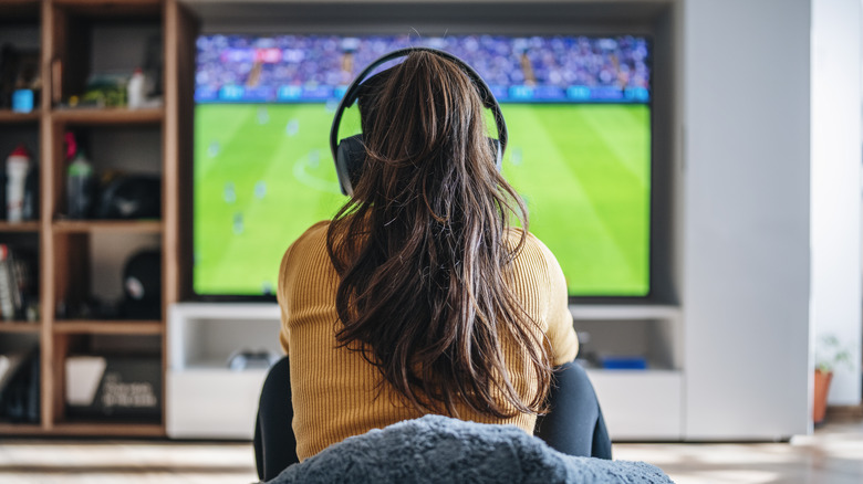 watching tv with headphones on