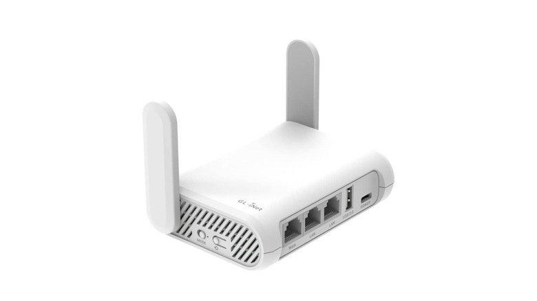 Mini WiFi router on white background