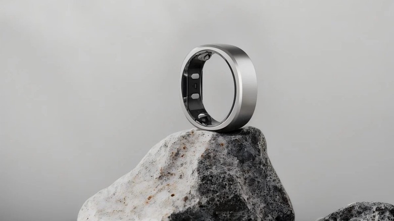 Ringconn Gen 2 smart ring resting atop a rock in view