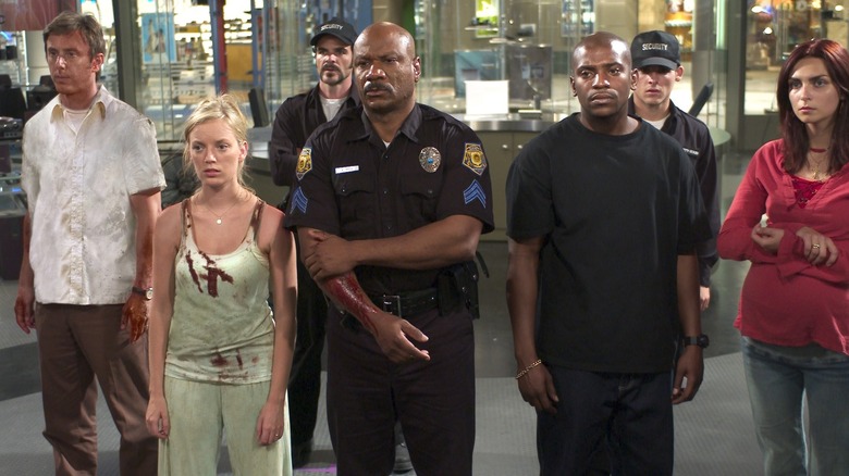 Ving Rhames, Mekhi Phifer, Sarah Polley, Michael Kelly, Inna Korobkina, Jake Weber, and Kevin Zegers stand together in "Dawn of the Dead."