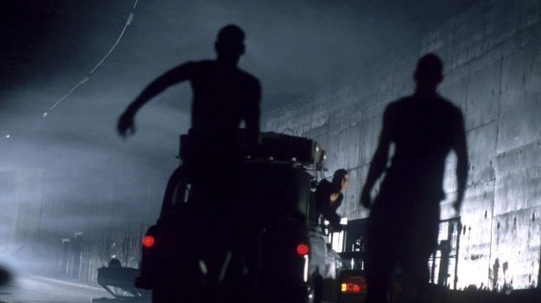 Zombies chasing after a London taxi with Jim (Cillian Murphy) inside in 