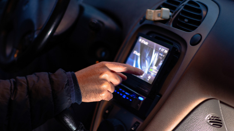 Person using a car's infotainment system