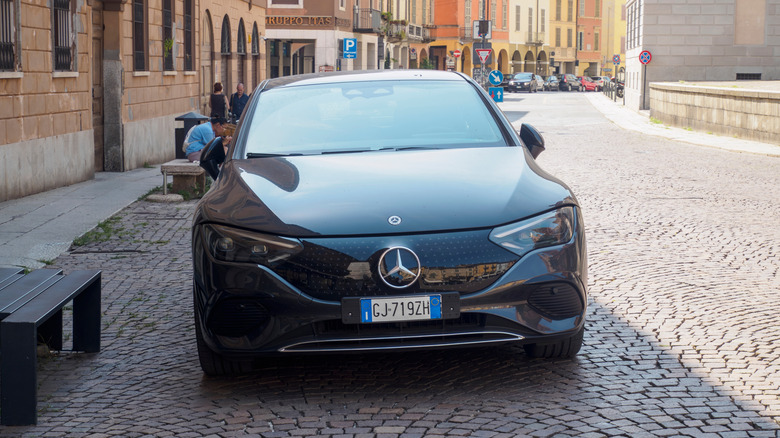 The Mercedez-Benz EQE SUV 2025 parked on a cobblestone street in Italy.