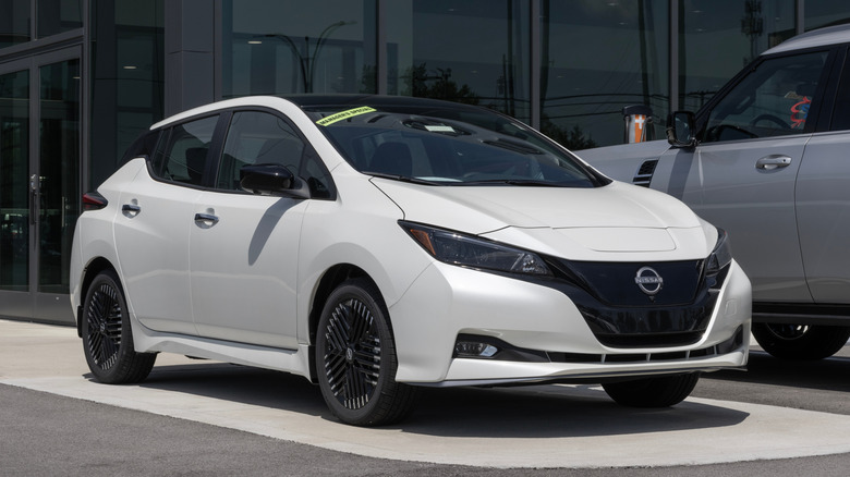 The Nissan Leaf 2025 on display at a dealership.