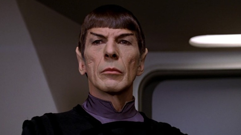 Spock on the bridge of the Enterprise, seen from the shoulders up.