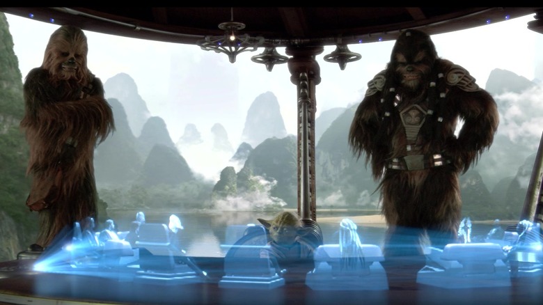 Chewbacca, Yoda, and another Wookie speaking with holograms of the Jedi Council