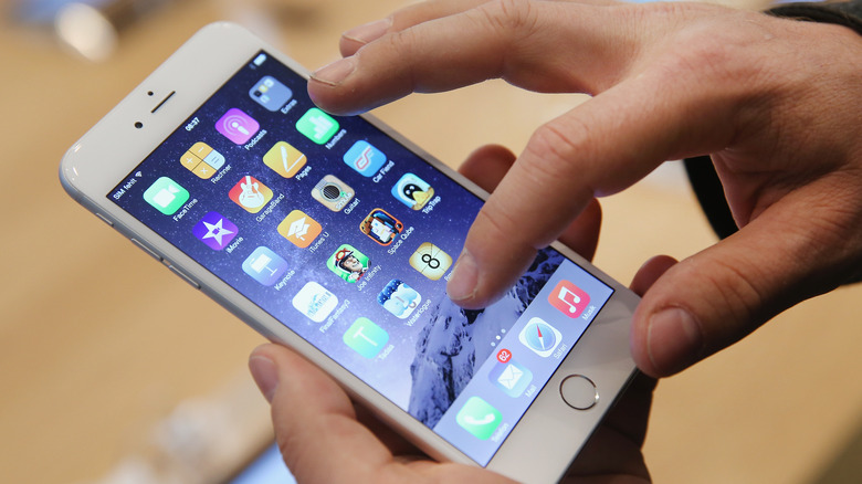 A shopper trying out the Apple iPhone 6