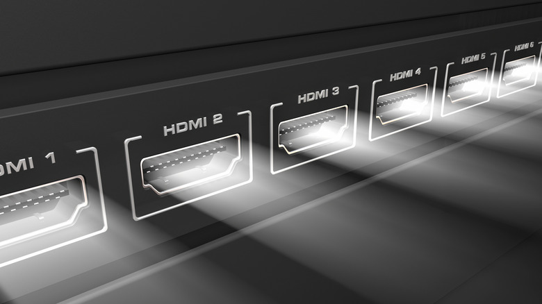 A line of HDMI ports emitting light.