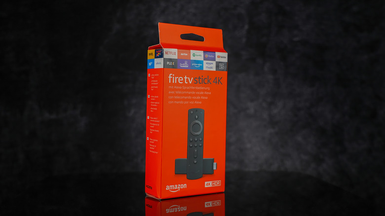 A new Amazon Fire TV Stick 4K in front of a black background