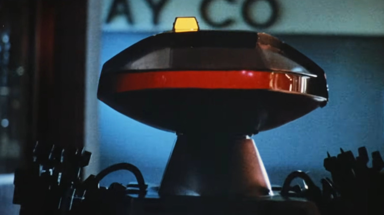 close-up still of robot killer from chopping mall movie