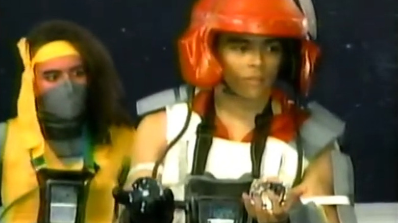 Two futuristic space pilots on a starry background