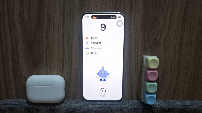 AirPods next to iPhone showing Jumpee app